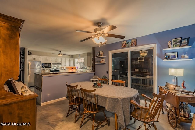 dining space featuring ceiling fan