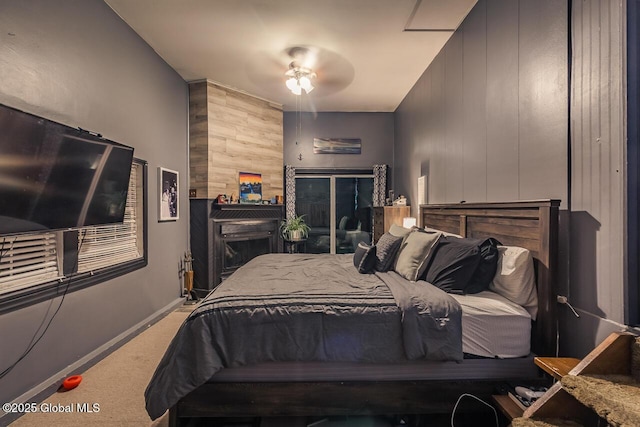 carpeted bedroom featuring wooden walls