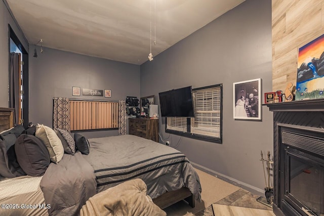 bedroom featuring a fireplace