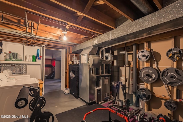 basement featuring gas water heater and heating unit