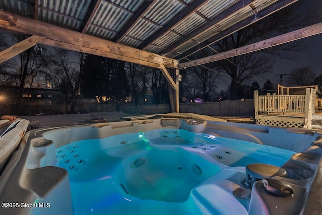 view of pool featuring a hot tub and a deck