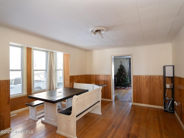 unfurnished dining area with dark wood-type flooring