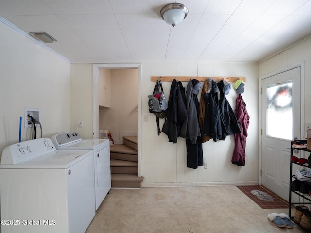 laundry area featuring washing machine and clothes dryer