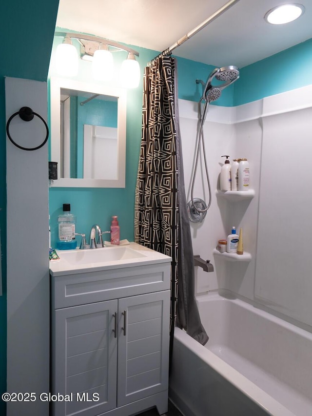 bathroom with vanity and shower / bath combo with shower curtain