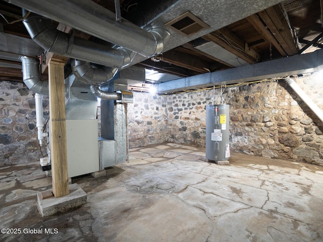 basement with water heater and heating unit