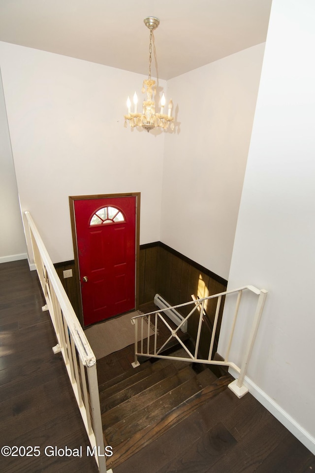 foyer entrance featuring a chandelier and hardwood / wood-style floors