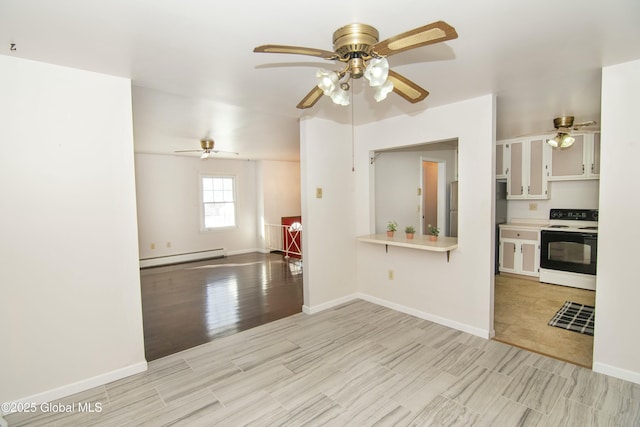 kitchen featuring stainless steel refrigerator, white electric stove, white cabinets, a baseboard heating unit, and light hardwood / wood-style flooring