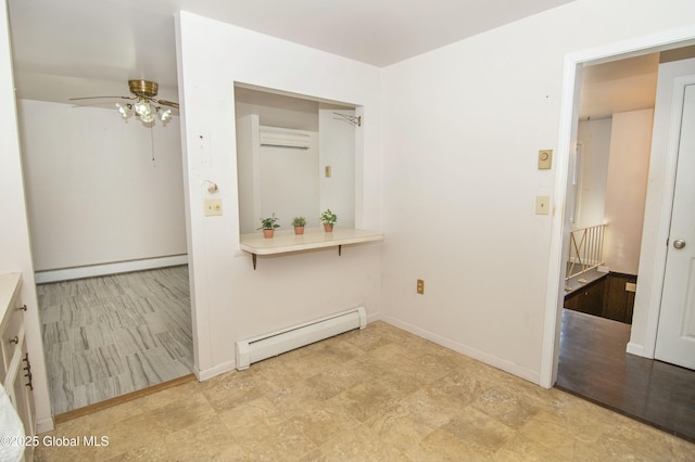 interior space featuring a wall mounted air conditioner and a baseboard heating unit