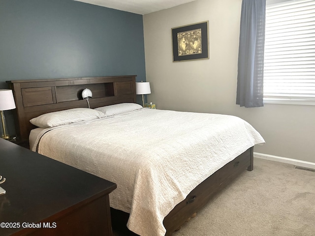 bedroom featuring light colored carpet