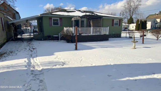 bungalow featuring a carport and a porch