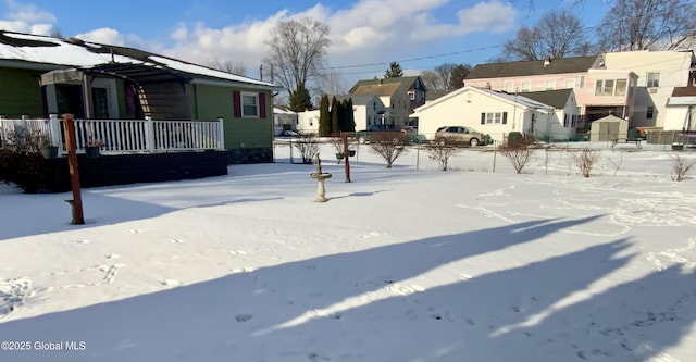 view of yard layered in snow