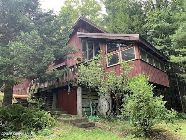 view of home's exterior featuring a sunroom