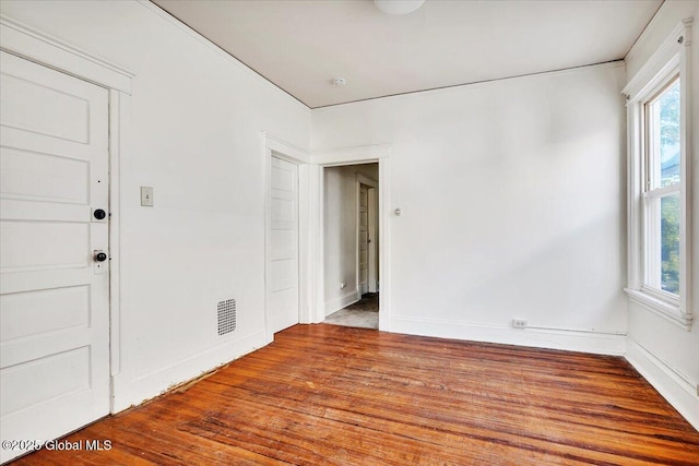 spare room featuring hardwood / wood-style floors