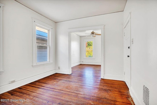 empty room featuring ceiling fan and hardwood / wood-style floors