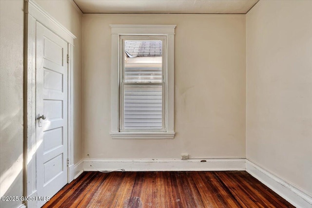 unfurnished room with dark hardwood / wood-style floors