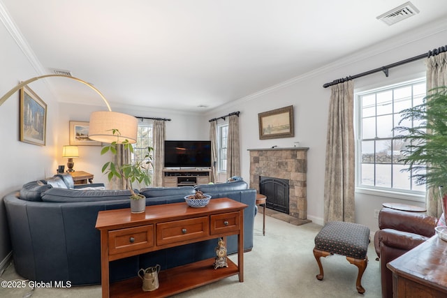 living room featuring crown molding, a stone fireplace, and light carpet