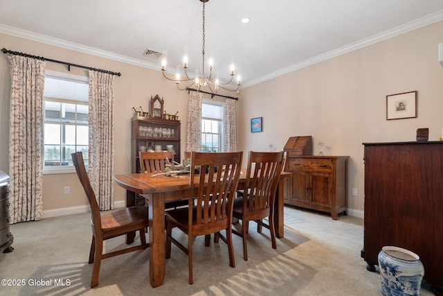 dining space with ornamental molding, plenty of natural light, light carpet, and a notable chandelier