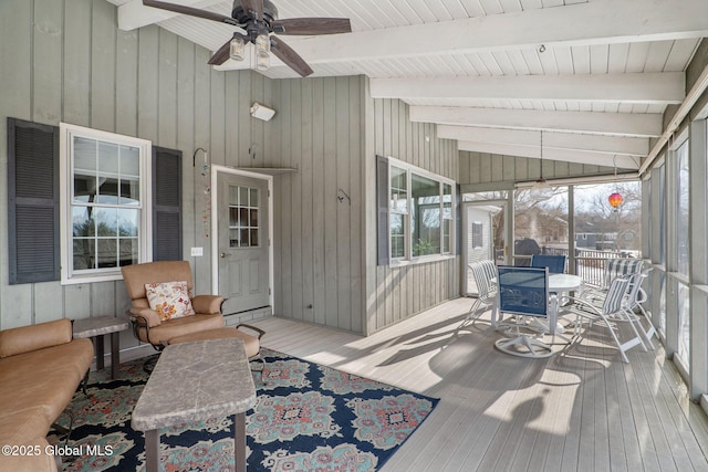 sunroom with vaulted ceiling with beams and ceiling fan