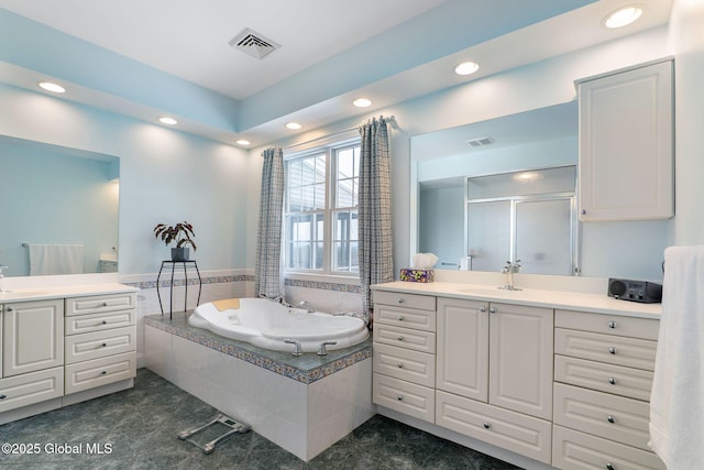 bathroom featuring plus walk in shower and vanity