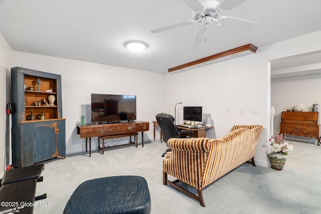 living room with ceiling fan and carpet