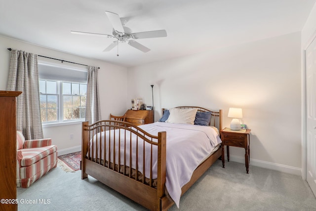 bedroom featuring light colored carpet and ceiling fan