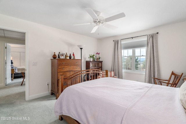 bedroom featuring ceiling fan and light carpet