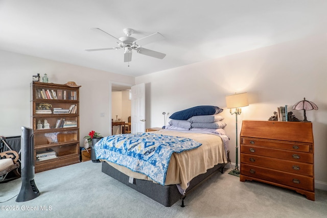 bedroom featuring light colored carpet and ceiling fan