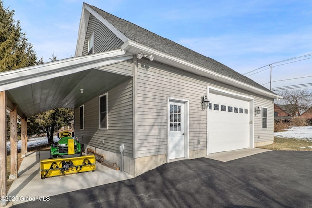 view of side of property featuring a garage