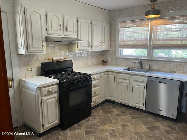 kitchen with backsplash, stainless steel dishwasher, white cabinets, and black range with gas cooktop