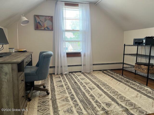 office space with hardwood / wood-style floors and vaulted ceiling