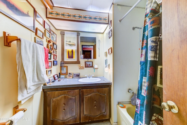 bathroom with shower / tub combo and vanity