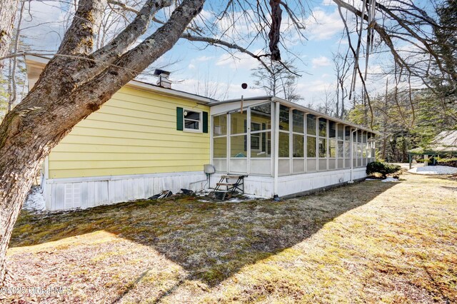 758 S Shore Rd E, Caroga Lake, Caroga, NY 12032 - view of side of home with a sunroom