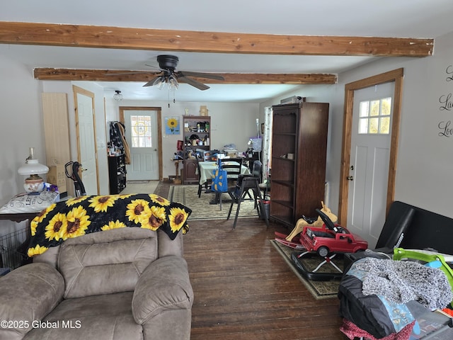 living room with dark wood-type flooring, ceiling fan, and a healthy amount of sunlight