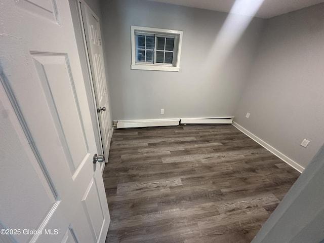 spare room featuring dark hardwood / wood-style floors