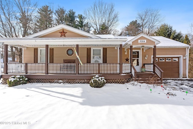 view of front facade with a garage and covered porch