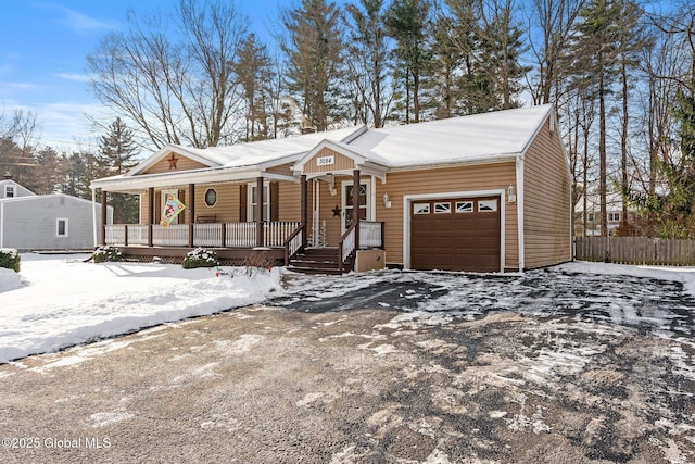 view of front of house featuring a porch and a garage