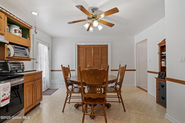 dining room featuring ceiling fan