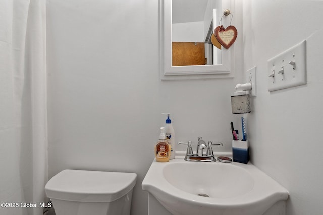 bathroom with sink and toilet