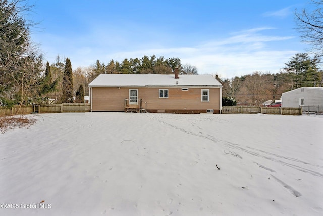 view of snow covered house