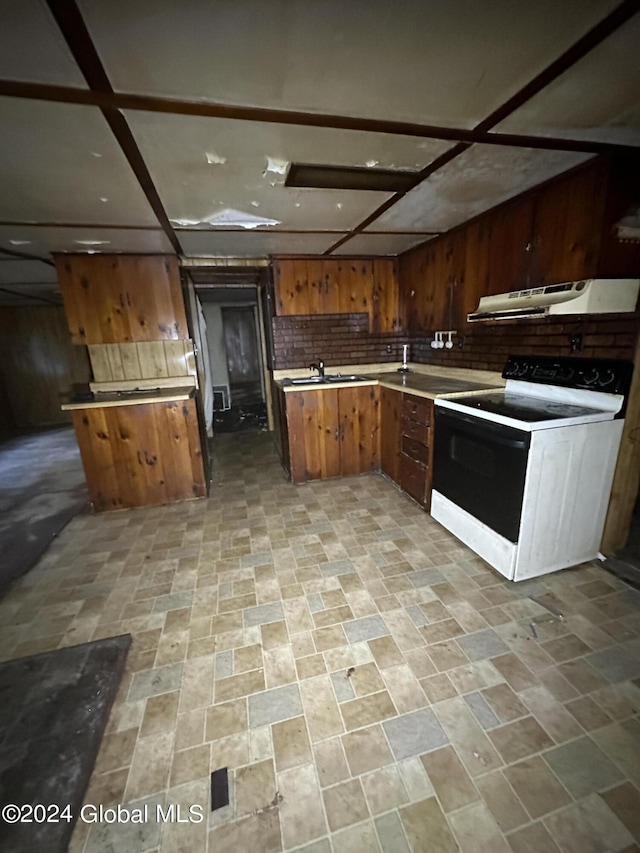 kitchen featuring sink and white electric range oven