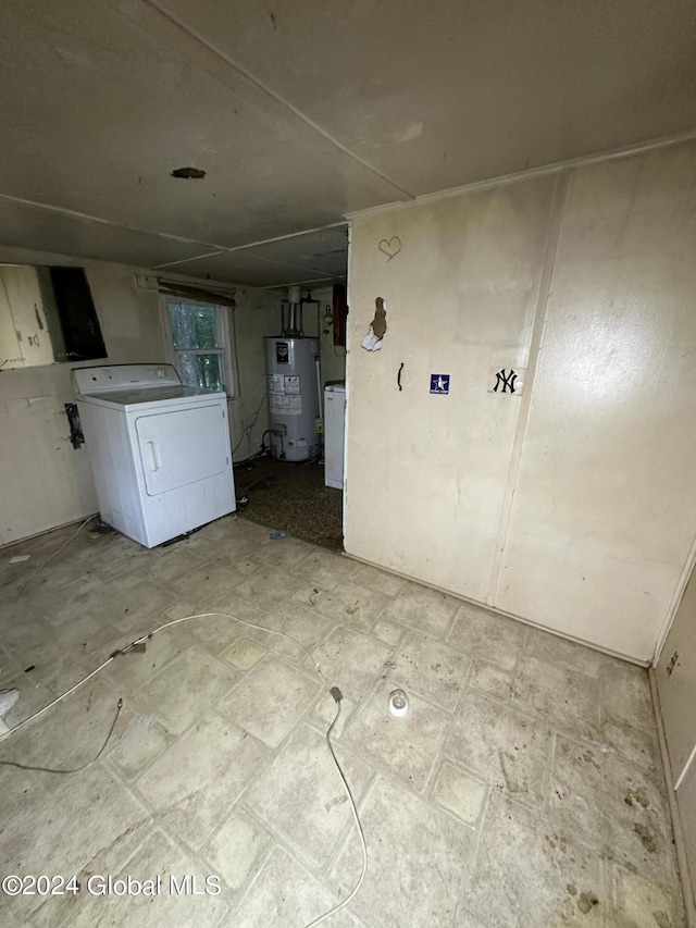 washroom with cabinets, water heater, and washer / clothes dryer