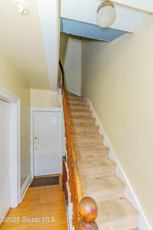 stairway featuring hardwood / wood-style floors