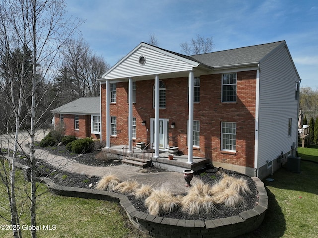 987 Grooms Rd, Rexford, NY 12148 - back of house with brick siding, a yard, and central air condition unit