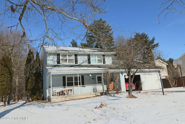 front facade featuring covered porch and a garage