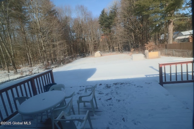 view of yard layered in snow