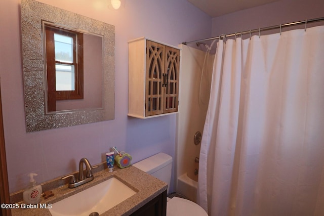 full bathroom with shower / bath combo with shower curtain, toilet, and vanity