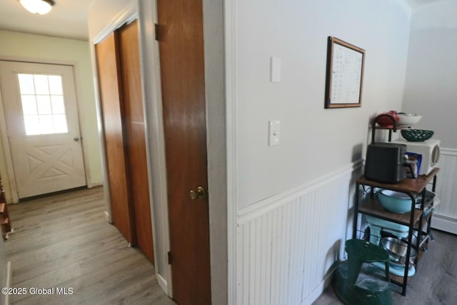 hall with light wood-type flooring