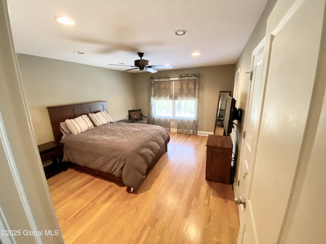 bedroom featuring ceiling fan and light wood-type flooring