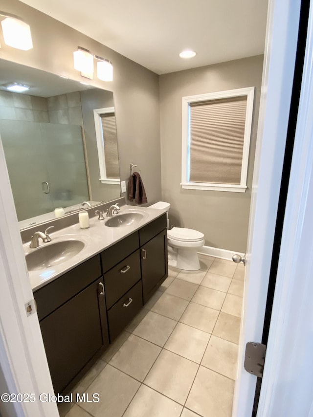 bathroom featuring tile patterned flooring, vanity, and toilet