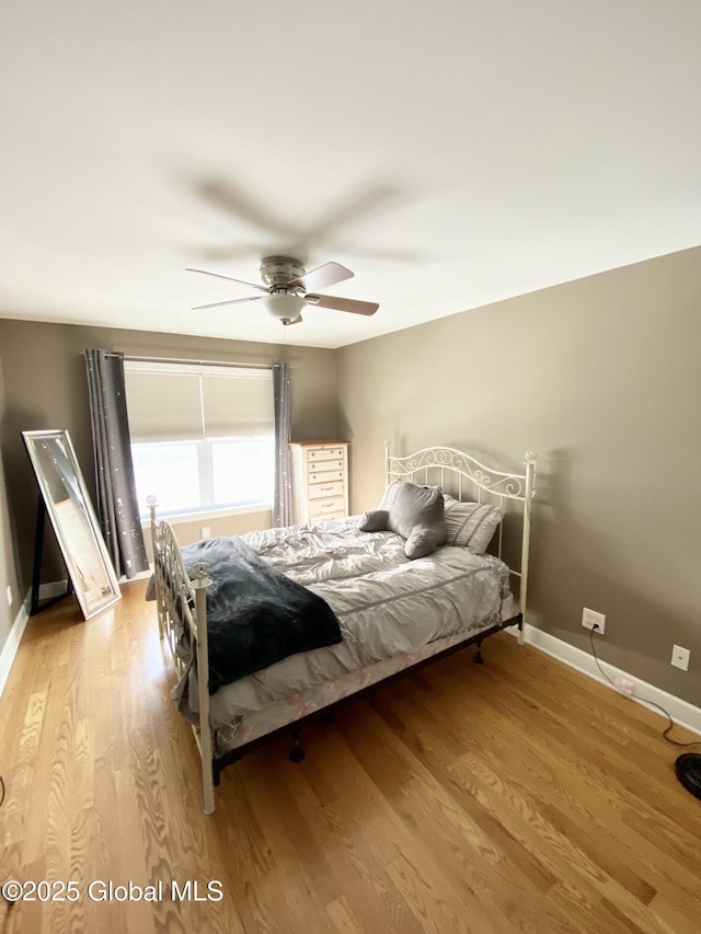 bedroom featuring ceiling fan and light wood-type flooring